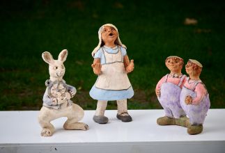 Alice and the White rabbit meet Tweedledum and Tweedledee Alice and the White rabbit meet Tweedledum and Tweedledee